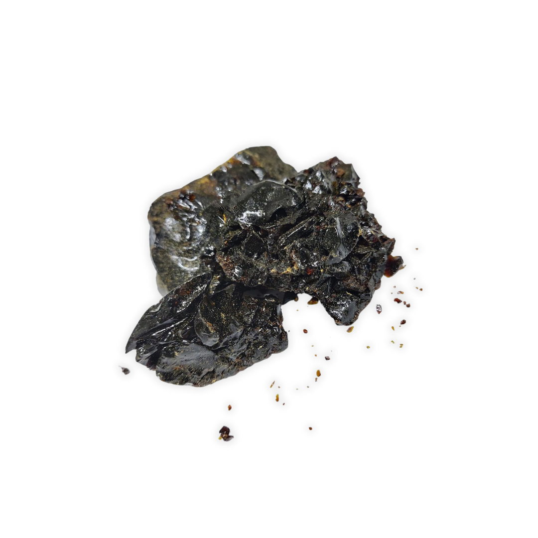 Black mineral sample on a white background
