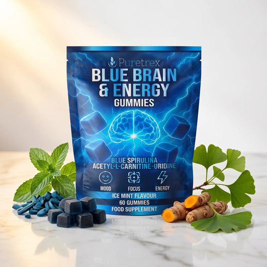 PURETREX Blue Brain and Energy Gummies food supplement front pouch in blue packaging shown on a white marble surface with fresh blueberries and green ginkgo leaves