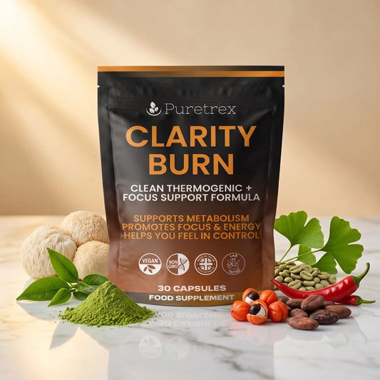 PURETREX Clarity Burn food supplement front pouch in dark and orange packaging shown on a white marble surface with coffee beans, red chilli and natural ingredients