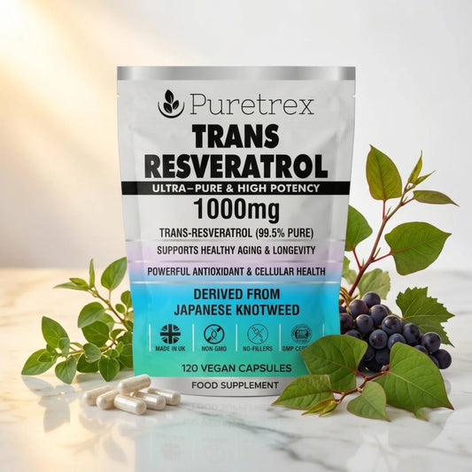 PURETREX Trans Resveratrol 1000mg food supplement front pouch shown on a white marble surface with red grapes, dark berries and botanical ingredients in premium packaging